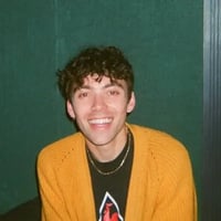 Headshot of Cole Townsend wearing a yellow sweater
